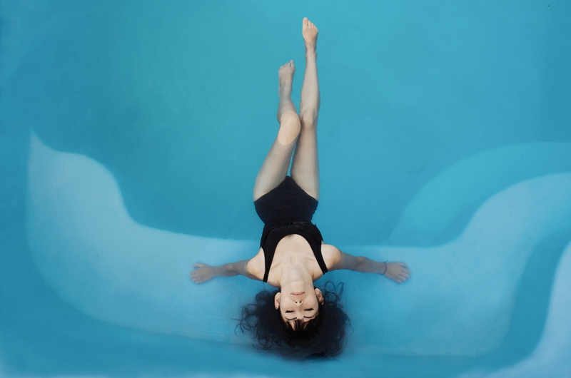 relaxing, black hair, handstand, one Person, swimming pool, swimwear, bathing suit, turquoise colored, upside down, young women, women, human arm, water