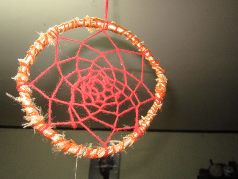 single object, close-up, 4K, celebration, nature, orange color, dreamcatcher, sport, geometric shape, circle, pattern, hanging, indoors, food, focus on foreground