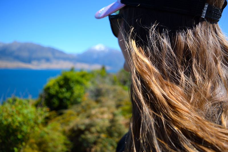 lake wanaka, hat, adult, mountains, lifestyles, one person, blonde, outdoors, new zealand, looking at view, mountain, portrait, sky, blond hair, nature