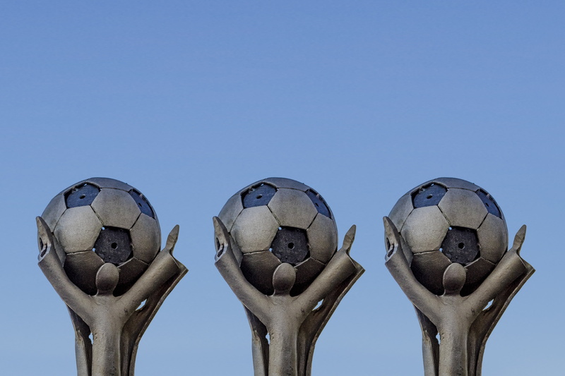 fun, sky, food, art, group of objects, no people, low angle view, play, sport, outdoors, football, trophy, nature, sculpture, cup, plant, community, body part