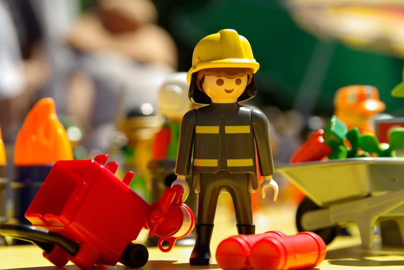 car, red, representation, male, male likeness, close-up, focus on foreground, figurine, closeup, playmobil, children, plastic, retail, photo, small, human representation