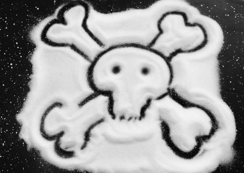 indoors, skull, human representation, auto post production filter, smiling, communication, art, close-up, emotion, anthropomorphic smiley face, skull and crossbones