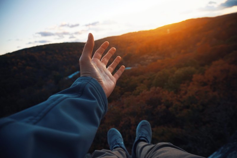 sunset, finger, low section, real people, tree, horizon, mountain range, unrecognizable person, leisure activity, highway, fall leaves, trees, scenery