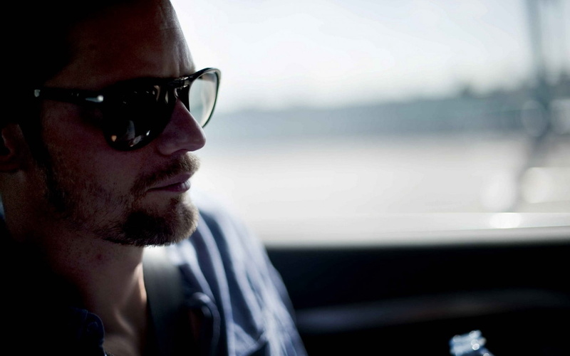 sunglasses, mode of transportation, profile view, beard, side view, actor, outdoors, young adult, window, close-up, vehicle interior, portrait, men, adult