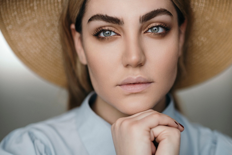 face, contemplation, indoors, hand, women, looking at camera, human body part, uncertainty, beautiful woman, adult, gray eyes, close-up, beauty, beautiful people