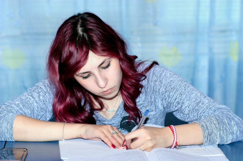 redhead, learning, study, one person, young women, headshot, emotion, girl, young adult, writing, person, dyed hair, contemplation, indoors, beautiful woman