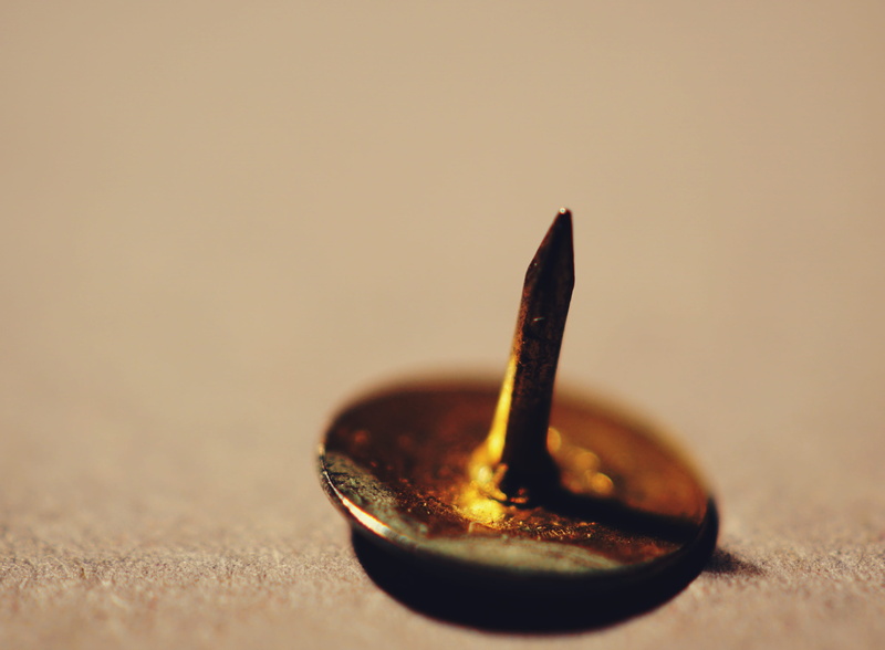 copy space, single object, thumbtack, table, studio shot, close-up, selective focus, still life, wood - material, no people, burning, eating utensil, indoors