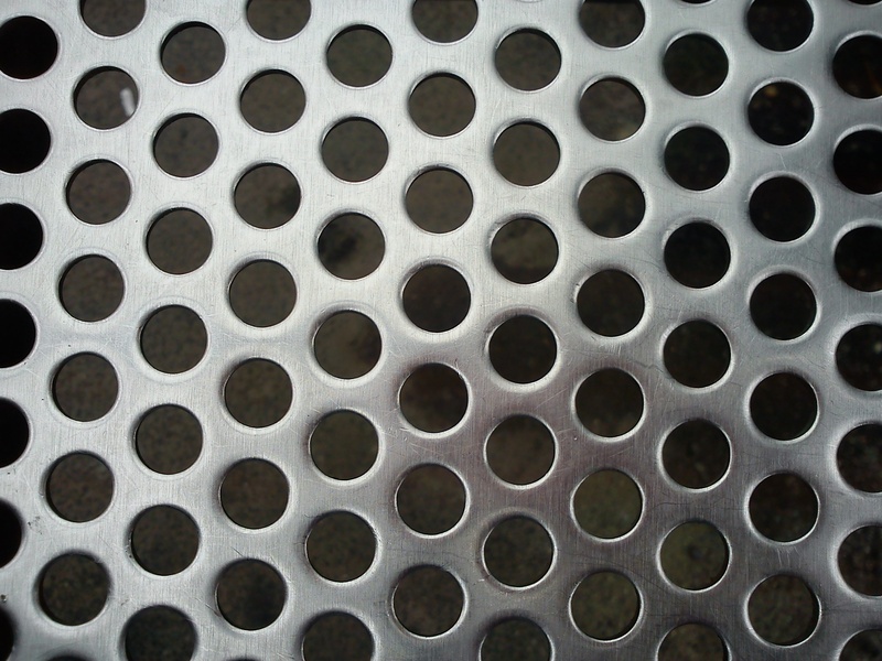 design, no people, holes, pattern, hole, in a row, reflection, circle, sheet, smooth, regularly, gloss, full frame, outdoors, backgrounds, order, repetition