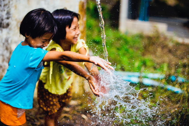 wall, joy, 1080P, wet, happy, spraying, playing, motion, garden hose, two people, girls, day, water, gray, innocence, near, playful, childhood, nature
