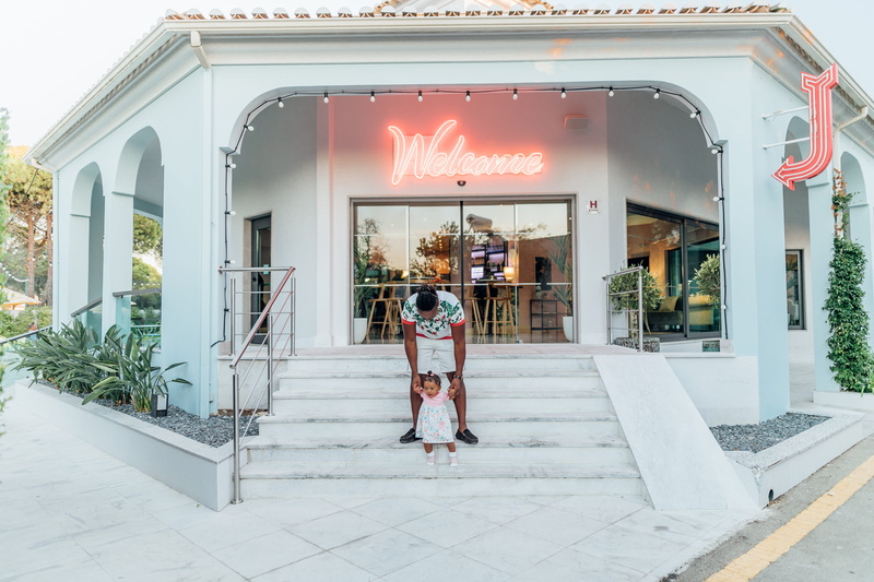 sign, holding, women, neon, baby, editorial, lifestyles, street, vacations, day, fashion, 4K, adult, architecture, building Exterior, welcome, luxury