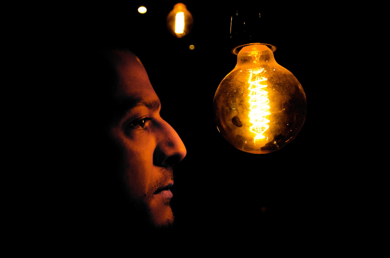 indoors, portrait, man, glowing, lifestyles, 2K, darkroom, dark, adult, illuminated, close-up, headshot, beard, human face, light, lighting equipment