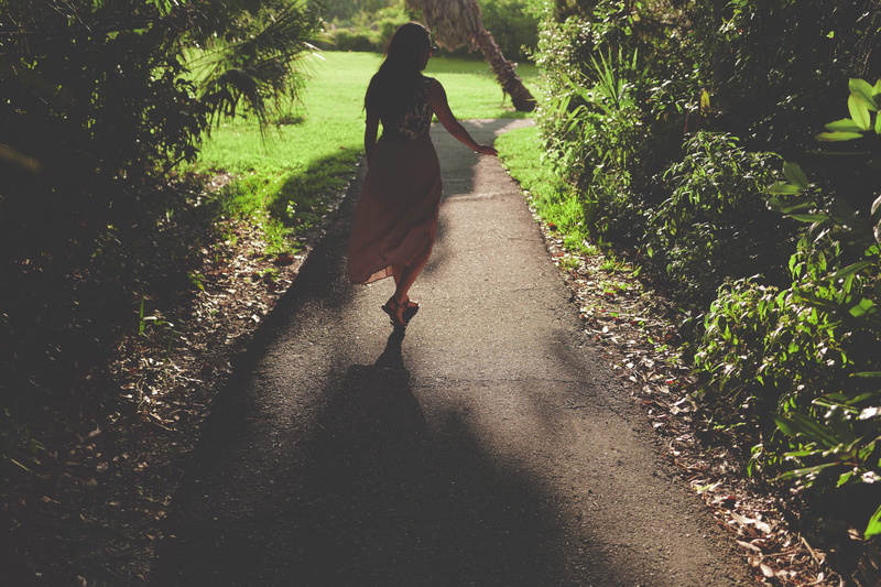 green, shrub, direction, full length, real people, day, woman, growth, women, lifestyles, plants, outdoors, shadow, walk, tree, footpath, path, walking