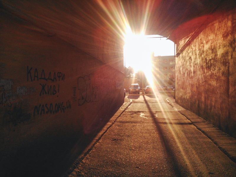 lens flare, beams, architecture, walk, bright, no people, suburban, building exterior, direction, alley, sunbeam, summer, text, street, western script