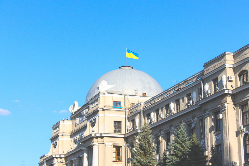 sky, europe, building exterior, built structure, city, patriotism, south station, architecture, blue, soviet, kharkiv, low angle view, background, government