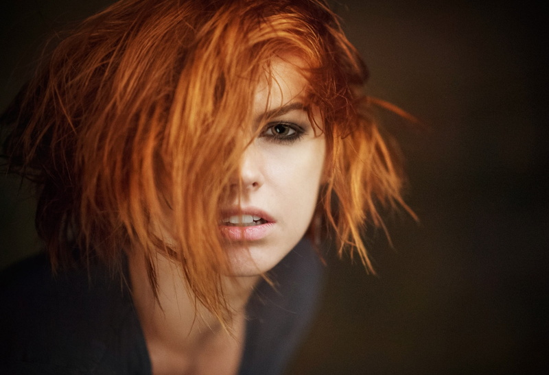 one person, 1080P, hairstyle, human hair, close-up, black background, women, portrait, young adult, dyed red hair, hair, indoors, human face, adult, contemplation
