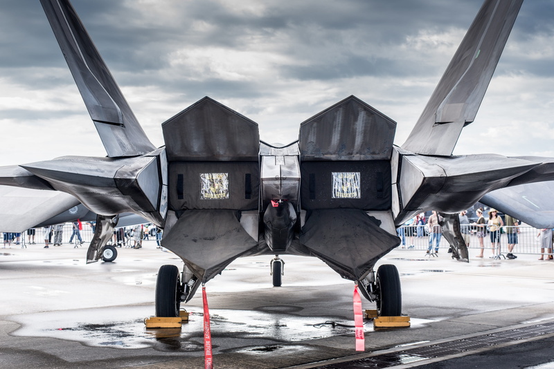 real people, building exterior, people, sky, mode of transportation, travel, built structure, f22, white, airshow, cloud - sky, outdoors, plane, runway