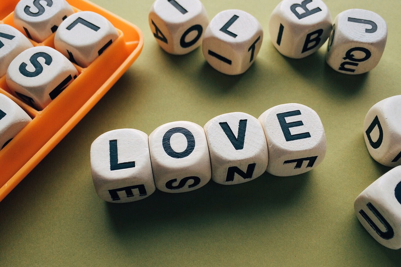 2K, boggle, table, group of objects, word, love, letter, high angle view, education, colored background, order, studio shot, text, western script, alphabet