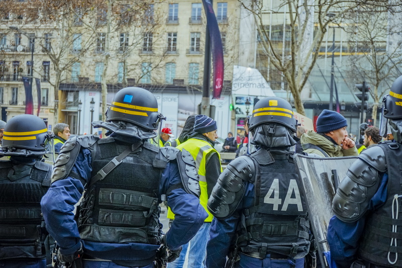 occupation, armored, pants, crowd, uniform, human, government, headwear, apparel, group of people, men, building exterior, army, logo, security, architecture