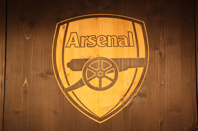 text, close-up, circle, copy space, no people, single object, communication, sign, arsenal, door, geometric shape, brown, painted, decor, gold colored