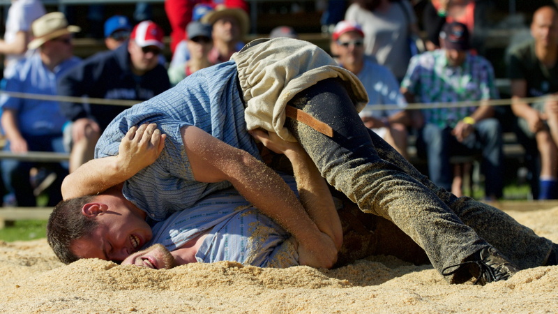 togetherness, incidental people, focus on foreground, emotion, lying down, casual clothing, relaxation, tradition, adult, positive emotion, force, sawdust