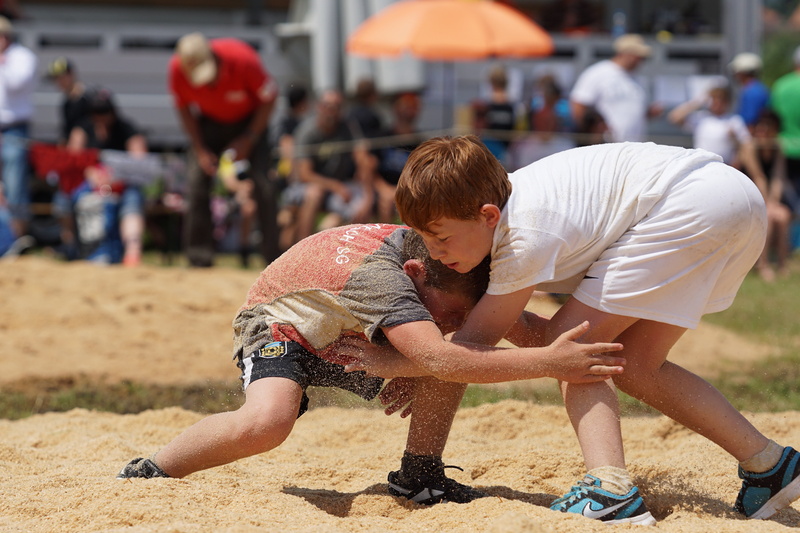 leisure activity, playing, land, innocence, wrestle, outdoors, two, sand, boy, sunlight, two people, competition, real people, child, people, bending, guys