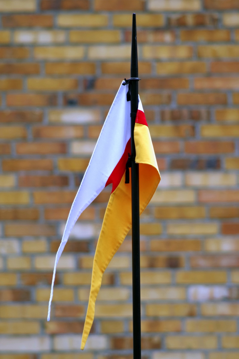4K, wall - building feature, brick wall, outdoors, white, yellow, hanging, brick, day, pennant, flag, white color, cavalry, close-up, built structure