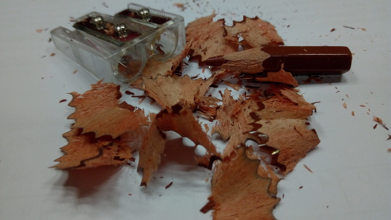 wood - material, messy, relations, peel, child, no people, used, grinder, high angle view, preparation, pencil shavings, white color, table, school, worn