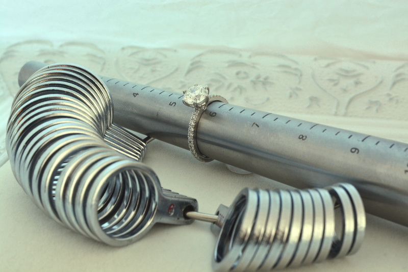 tools, no people, rolled up, focus on foreground, table, pattern, mandrel, number, equipment, studio shot, connection, cable, metal, tool, industry, ring