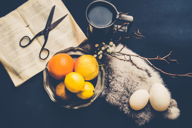 food and drink, scissors, table, household equipment, healthy eating, food, wellbeing, orange, orange color, book, kitchen utensil, black background, lemon