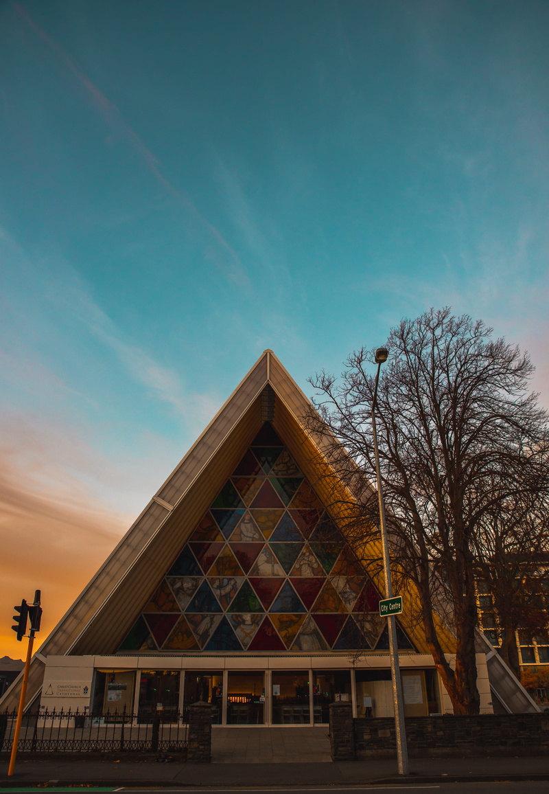 place of worship, facade, church, cloud - sky, plant, christchurch, roof, low angle view, building, urban, building exterior, religion, city, tree, explore