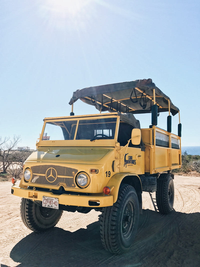 tractor, beach, shadow, field, flare, no people, off-road vehicle, mercedes, car, road, ocean, yellow, day, van, suv, land vehicle, vehicle, land, mode of transportation