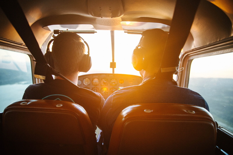 sky, sunset, daytime, transportation, cockpit, vehicle seat, plane, flying, lens flare, piloting, mode of transportation, seat, indoors, travel, sunrise