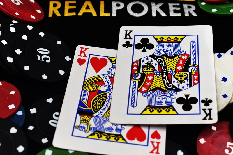 risk, 5K, number, poker chips, leisure games, luck, no people, casino, human representation, text, indoors, communication, poker, texas, cards, opportunity