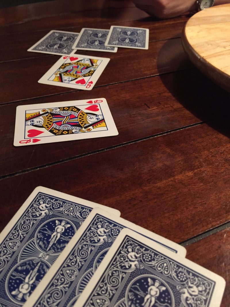 cards, representation, gambling, floral pattern, opportunity, still life, leisure games, game, history, deck, table, indoors, hearts, no people, human representation