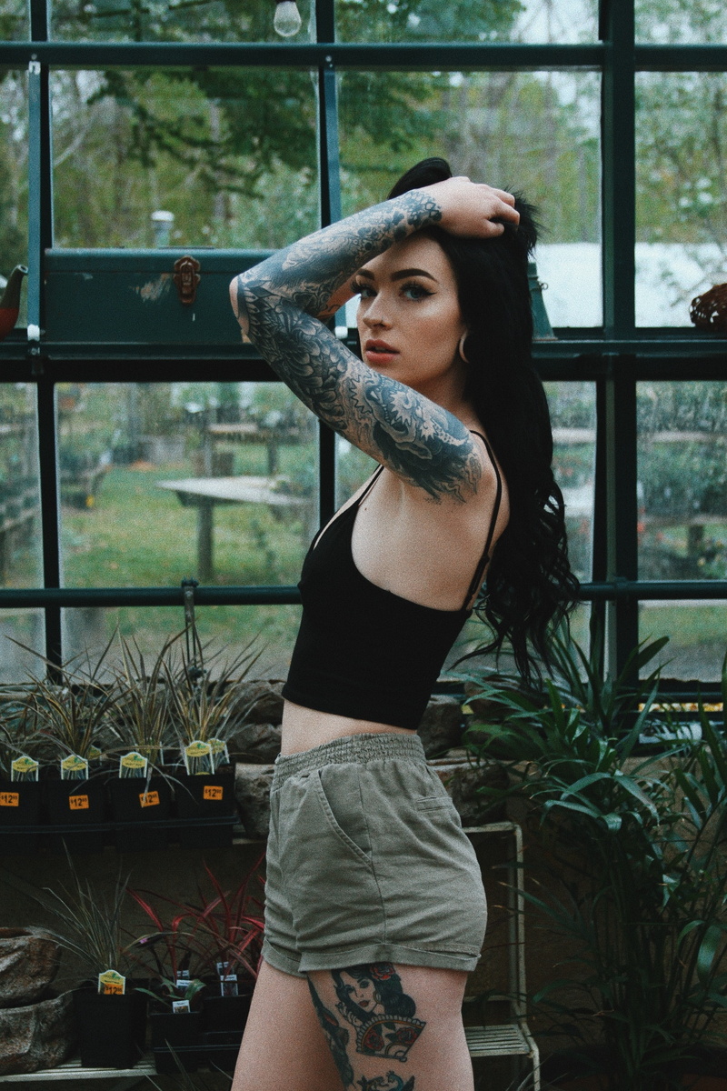 hands in hair, beautiful woman, women outdoors, hair, standing, 2K, lifestyles, black hair, clothing, women, young women, indoors, three quarter length