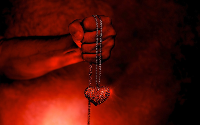 hanging, focus on foreground, people, emotion, personal accessory, single object, human hand, studio shot, indoors, human body part, wealth, red, jewelry