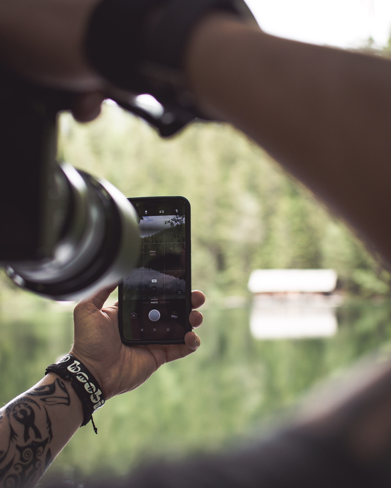 austria, human hand, piburger see, smartphone, outdoors, picinpic, nature, photographic equipment, communication, closeup, day, pictureinpicture, technology