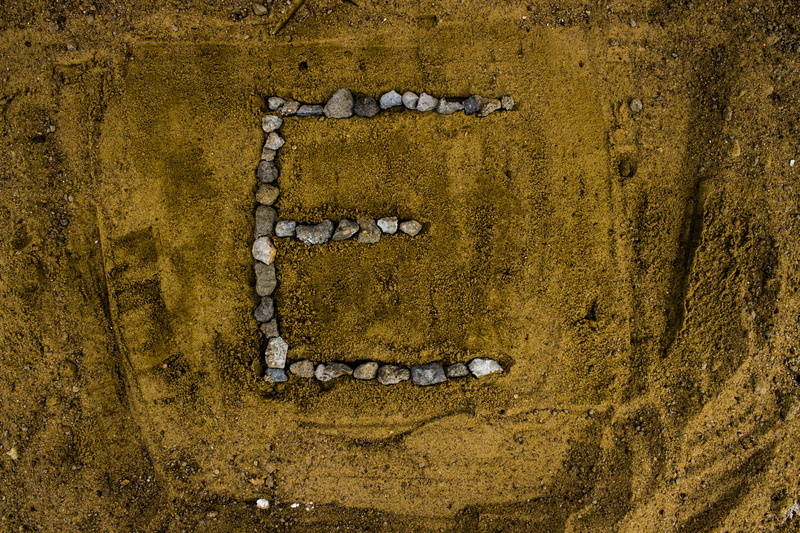 concrete, wall, nature, land, alphabet e, built structure, art and craft, alphabet letters, wall - building feature, directly above, close-up, high angle view