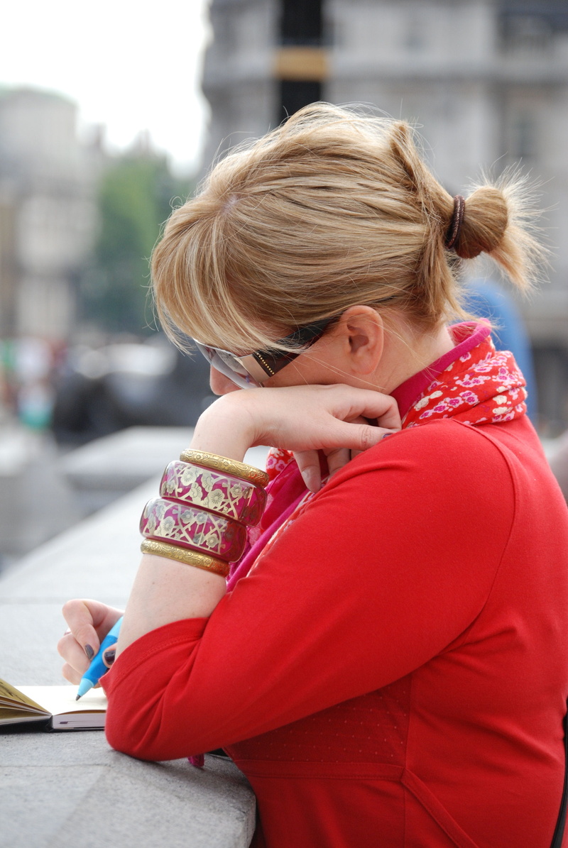 females, female, sitting, outdoors, woman, blond Hair, writing, day, bangles, real people, pen, elegant, education, leisure activity, red, artist, learning
