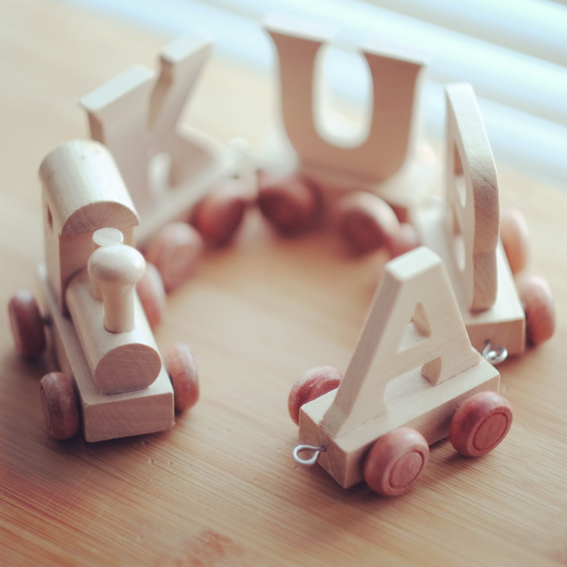selective focus, handicraft, childhood, child, day, focus on foreground, indoors, design, group of objects, wood, still life, table, letters, toy, variation