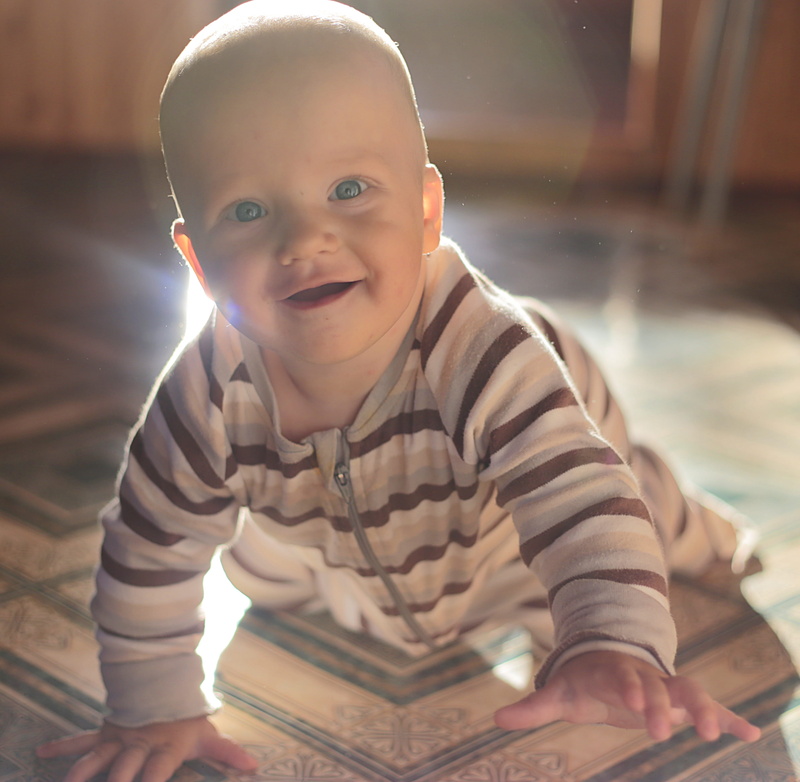 looking at camera, laughter, casual clothing, home interior, handsome man, photo, males, innocence, 2K, person, baby, crawling, men, small child, footed
