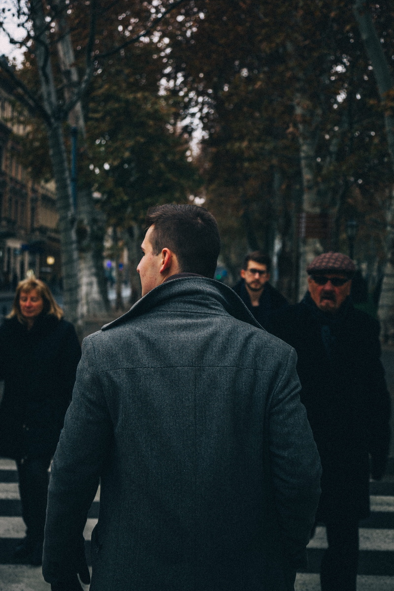 coat, asphalt, standing, people, lifestyles, plant, walking, leisure activity, tree, architecture, road, tarmac, sunglasses, city, clothing, man, group of people