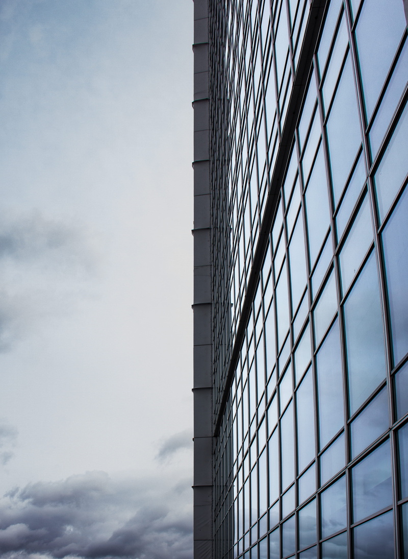 tower, steeple, pattern, banister, architecture, skyscraper, curtain, sky, glass - material, directly below, wall, no people, railing, tall - high, symbol