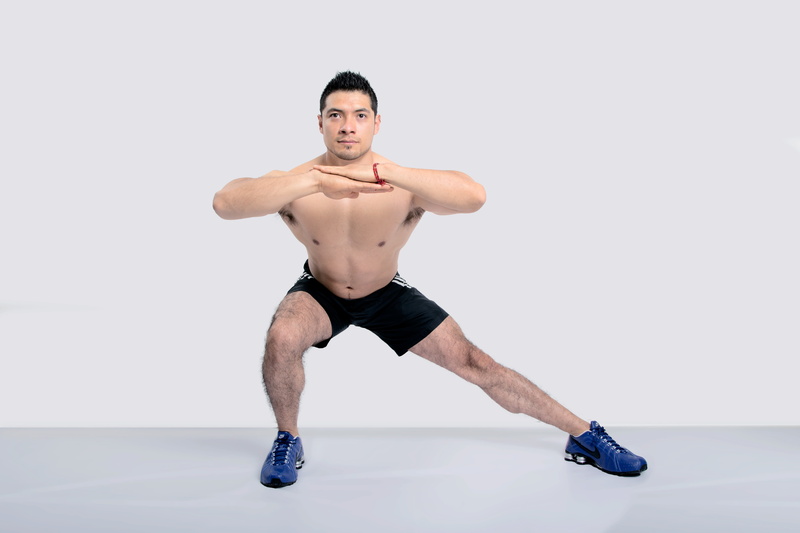 studio shot, athlete, lateral lunges, men, fitness, mid adult, legs, exercise, front view, one man only, indoors, males, healthy lifestyle, white background
