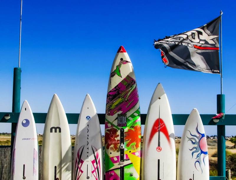 no people, Surf, Surfboards, flag, creativity, day, clear sky, sport, low angle view, sculpture, cyprus, 2K, male likeness, Club, outdoors, multi colored