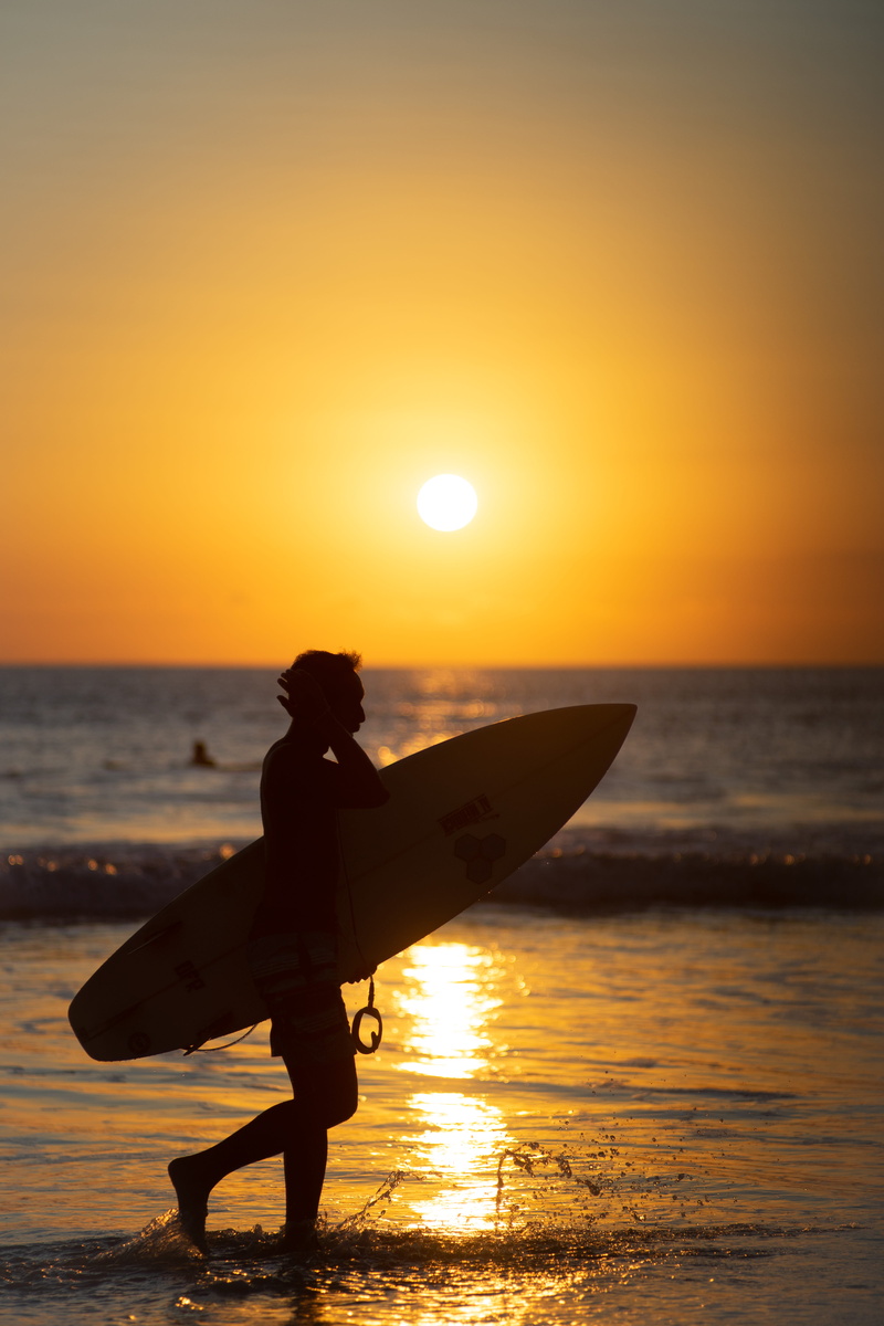 sunset, silhouette, 5K, outdoors, orange color, leisure activity, scenics - nature, beach, man, sky, horizon, surfboard, lifestyles, water, horizon over water