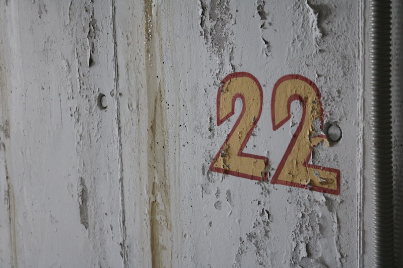 door, library, Number, no people, sign, architecture, text, wood - material, wall - building feature, outdoors, Garage, indoors, 22, know, metal, day, close-up