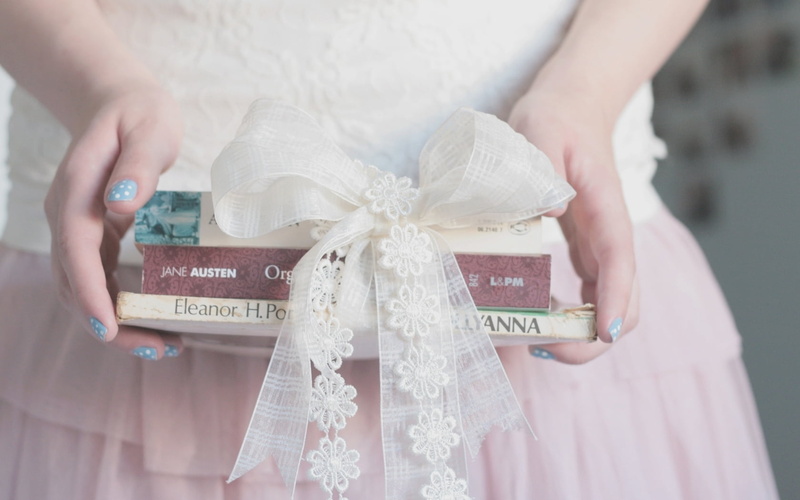 paper Currency, currency, people, caucasian Ethnicity, front view, one Person, giving, finance, celebration, assorted, holding, books, hand, ribbon, white