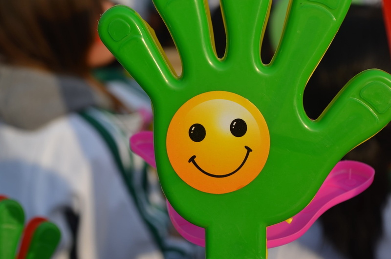 creativity, yellow, close-up, happy face, childhood, day, noise maker, multi colored, smiling, fun, noisy, happy, clap, one person, toy, holding, child