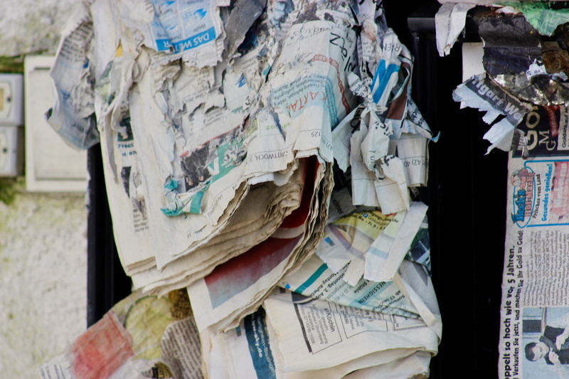person, recycling symbol, bag, textile, diaper, universe, stack, day, shabby, money, newspaper, paper currency, indoors, abundance, large group of objects